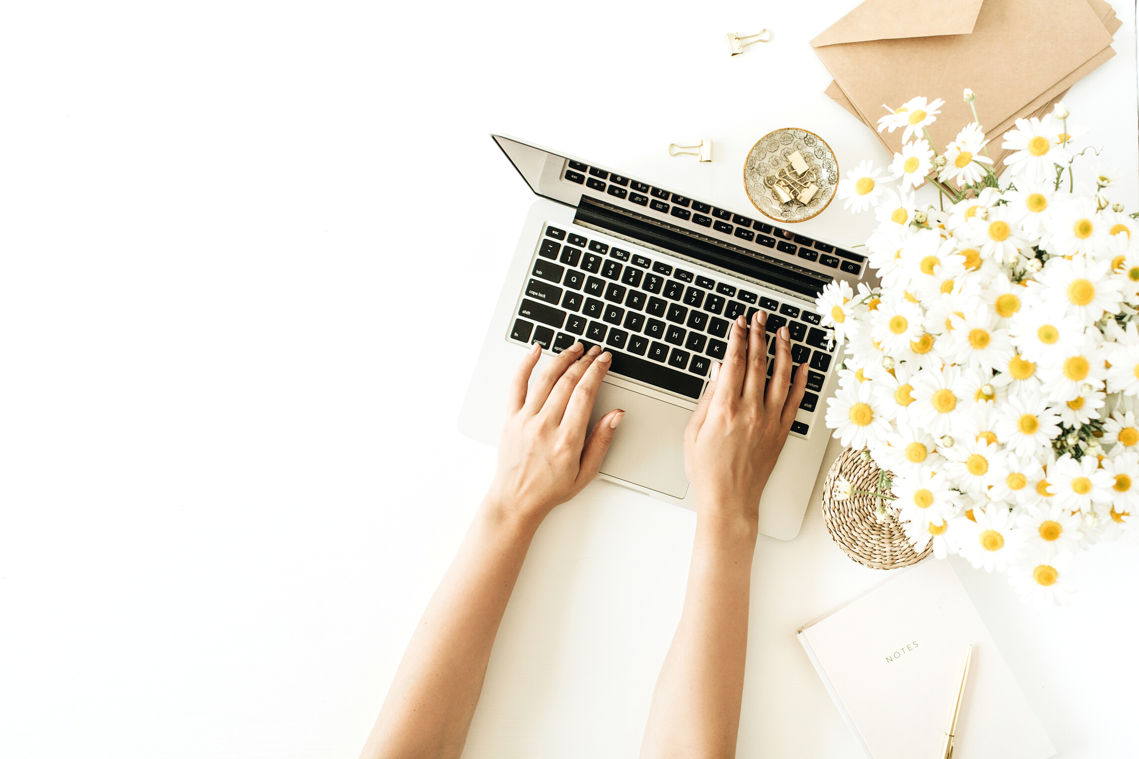 Woman Typing on Laptop